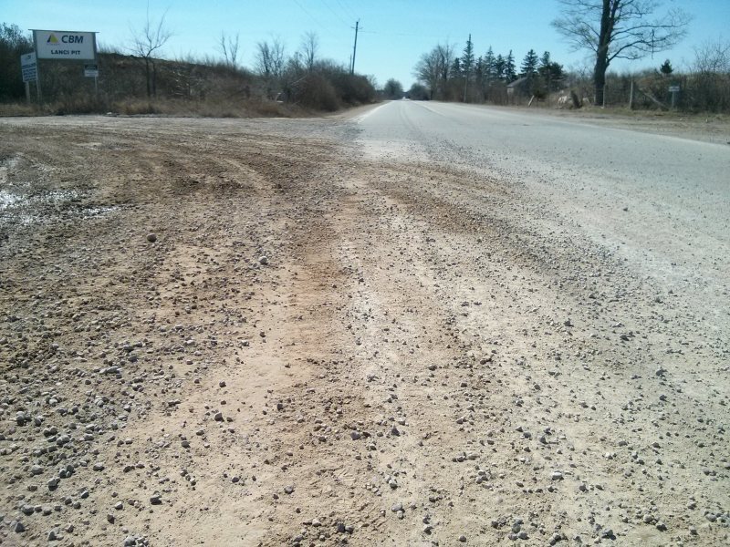 Gravel and dirt covering Concession 2 Eastbound lanes, Puslinch, Ontario